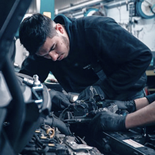 Mechanic working on a car engine